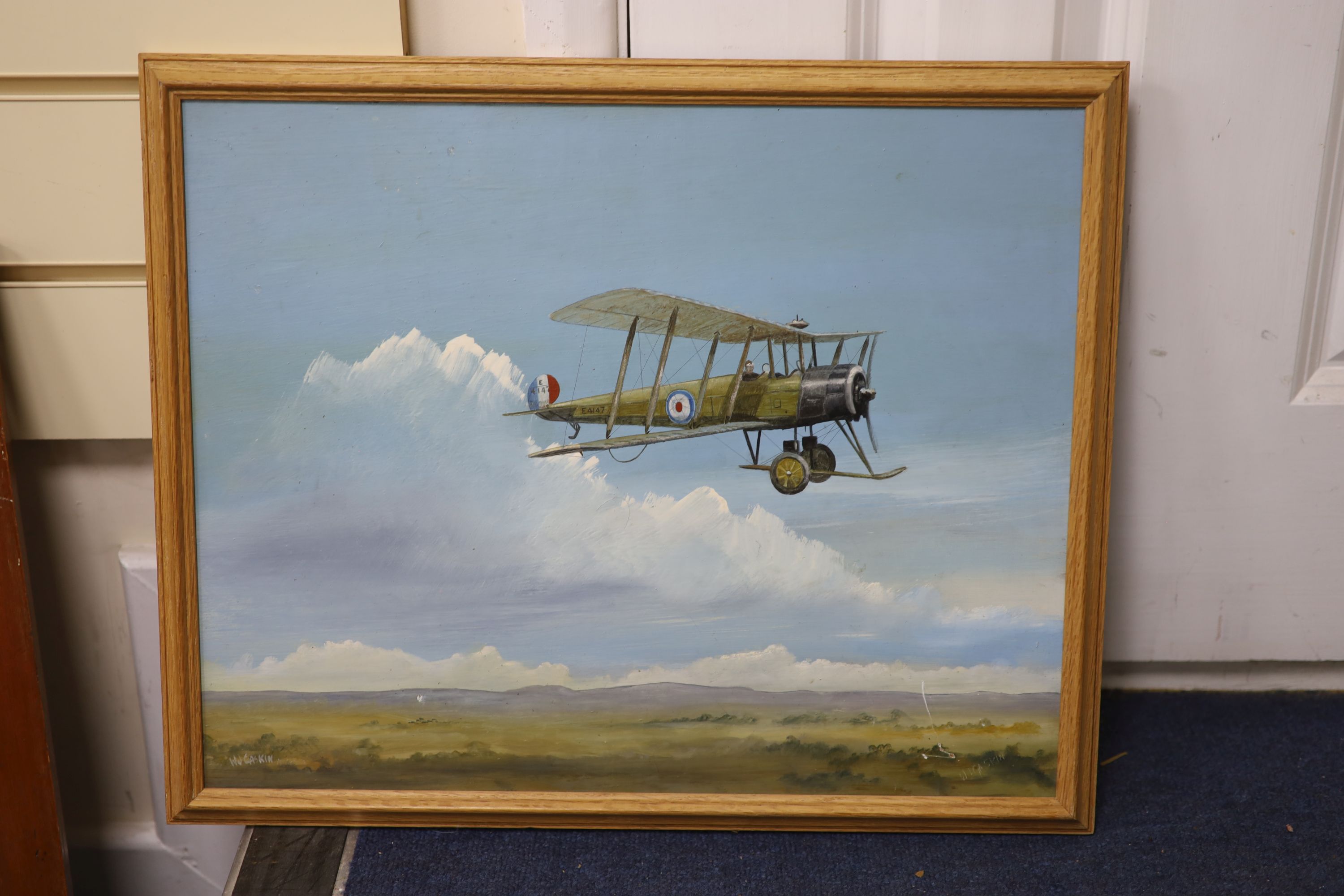 W.J. Gaskin, oil on board, WWI bi-plane in flight, signed, 36 x 44cm